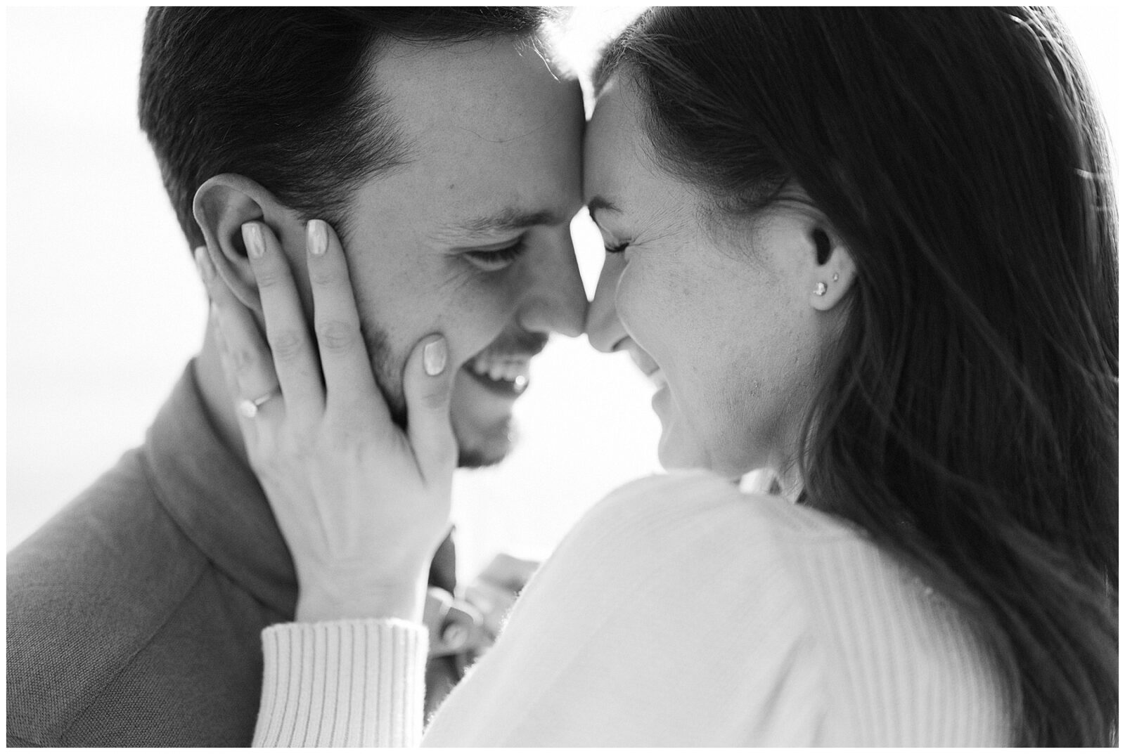 black and white image of couple embracing during their lake tahoe engagement session