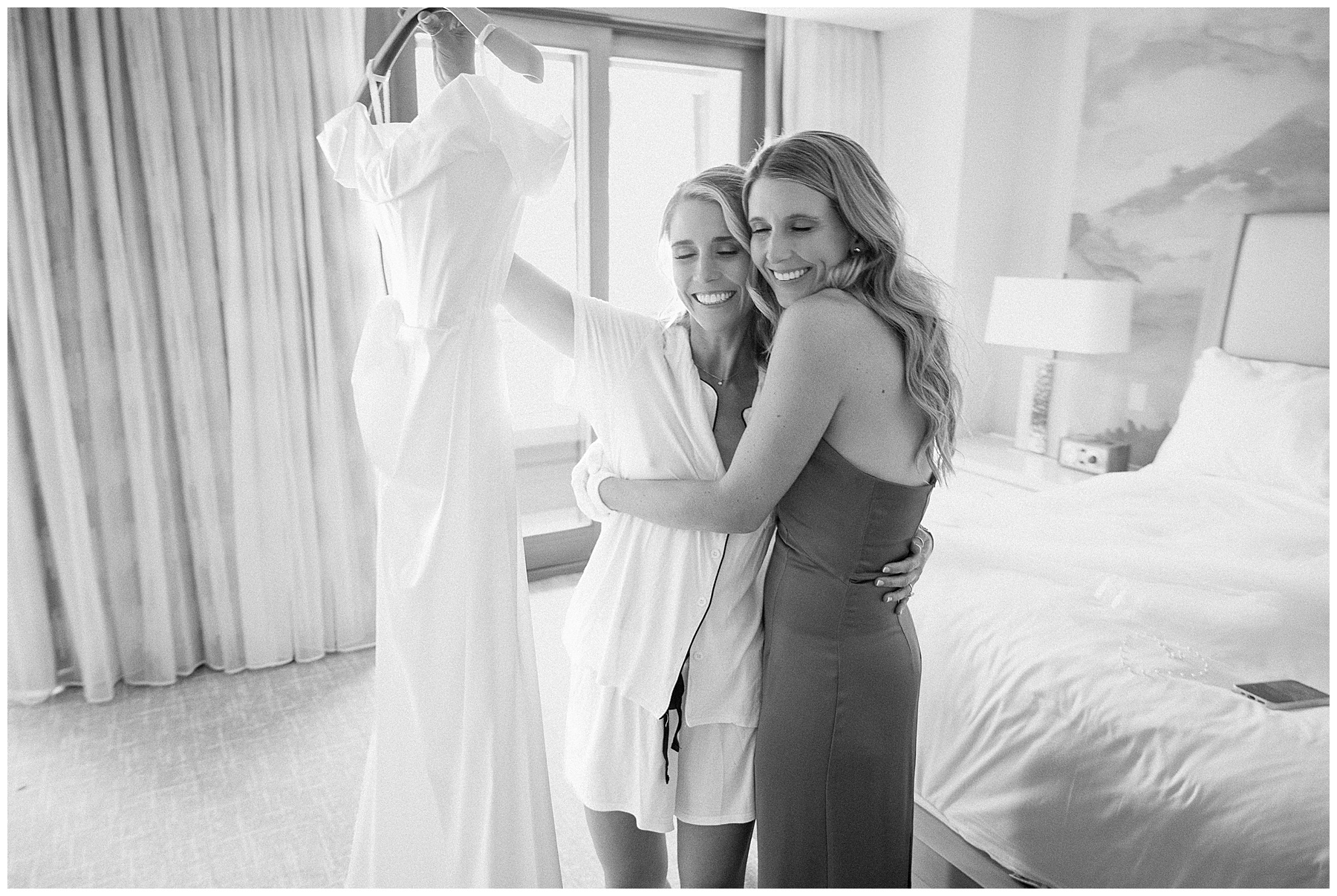 Sweet getting ready moment with bride and sister at Ritz-Carlton suite