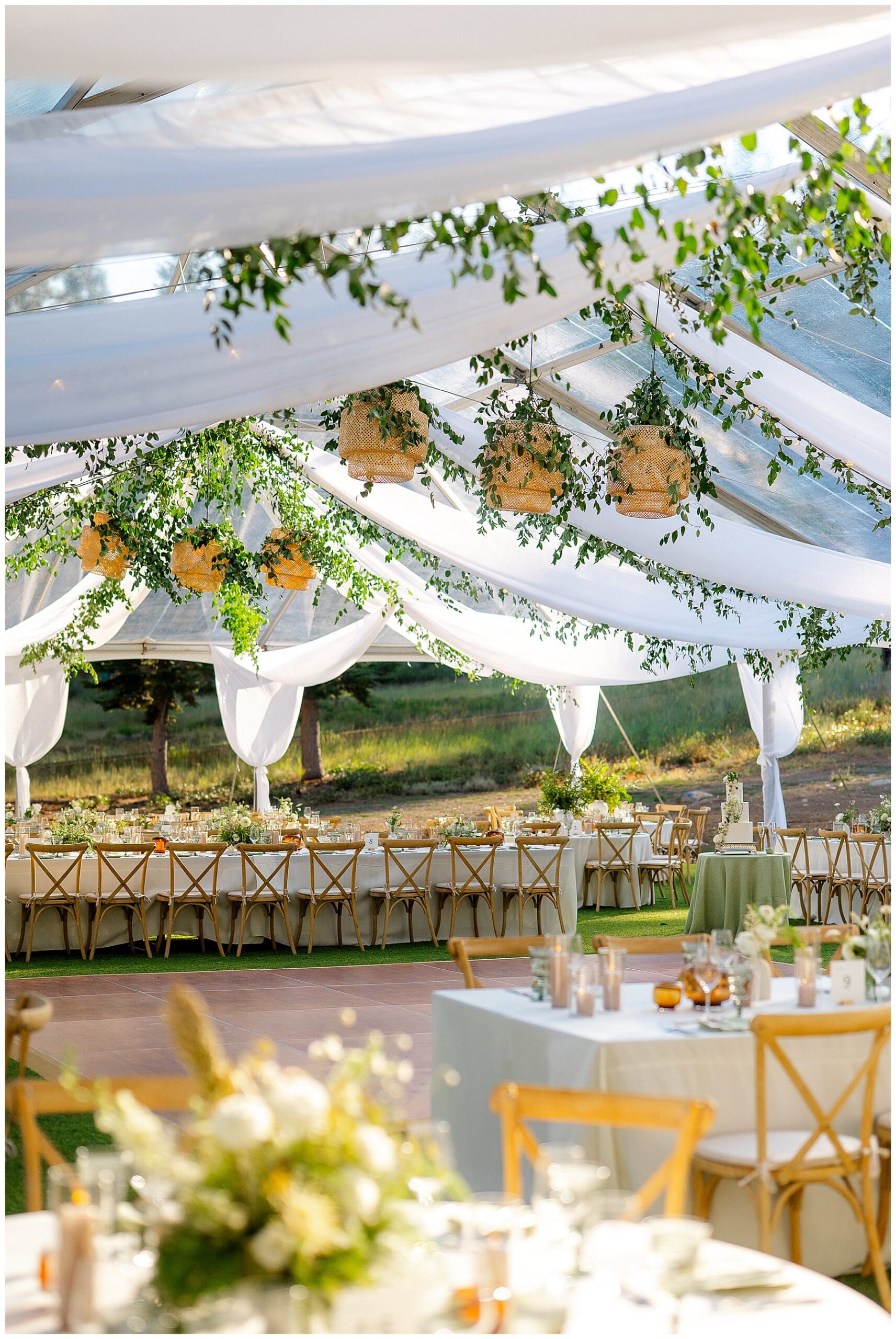 Tented mountain-view wedding reception with greenery and lanterns at Ritz-Carlton Tahoe