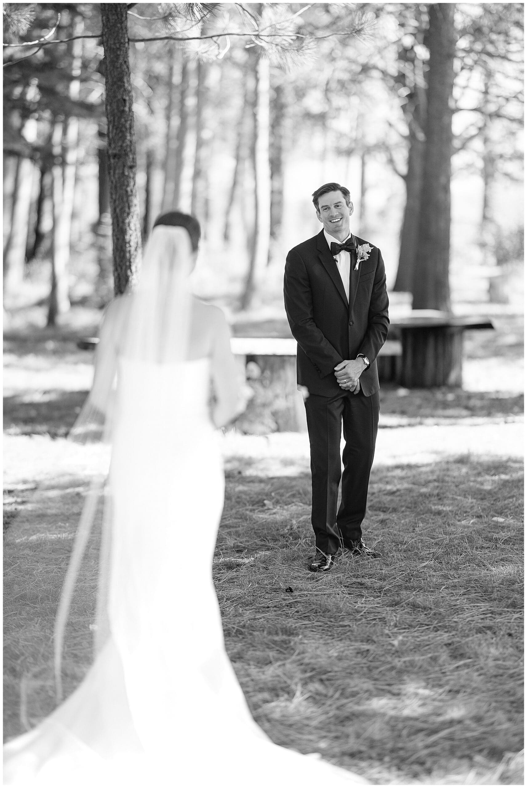 Emotional first look on private pier before Sunnyside Lake Tahoe wedding