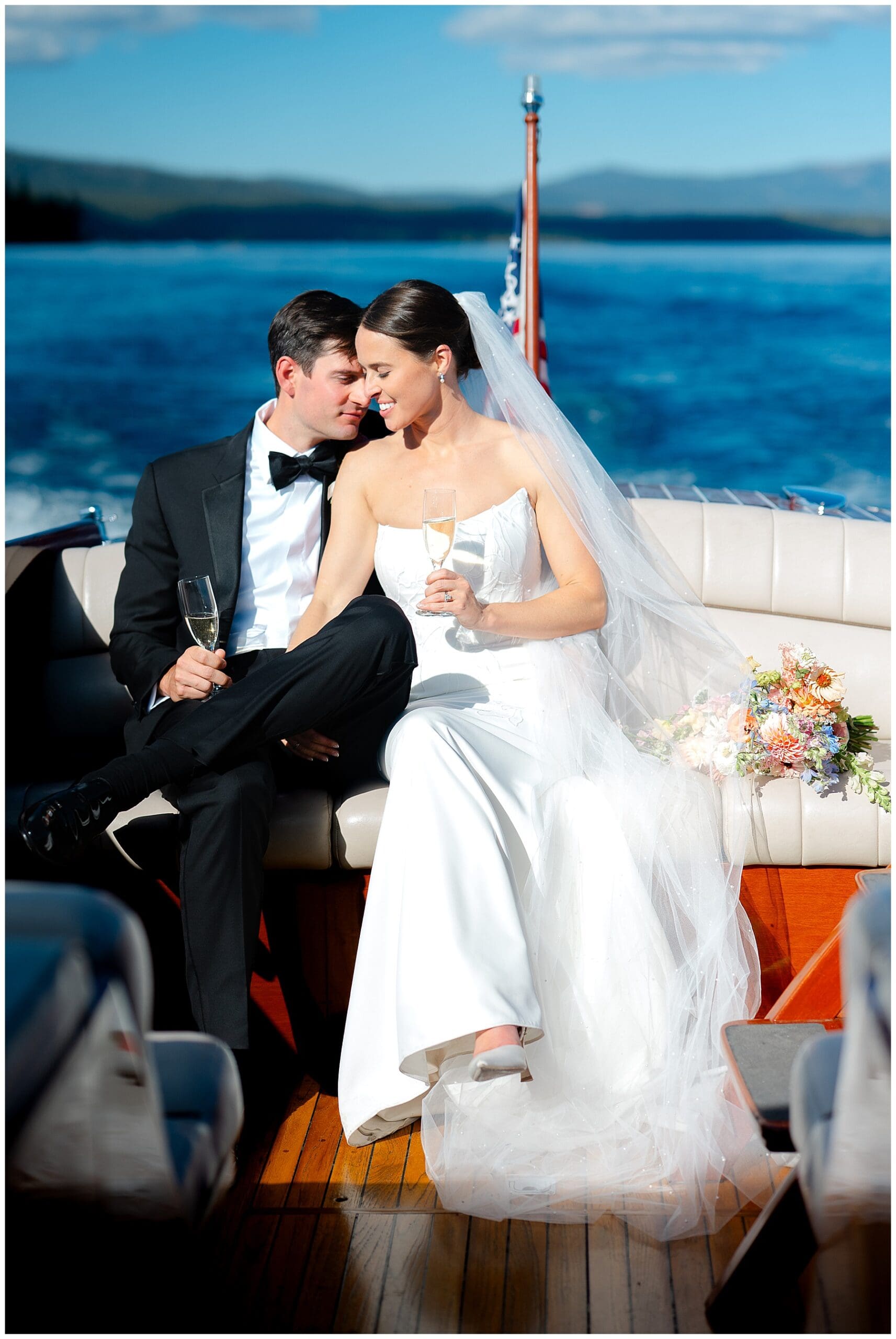 Bride arriving by boat for Sunnyside Lake Tahoe wedding ceremony